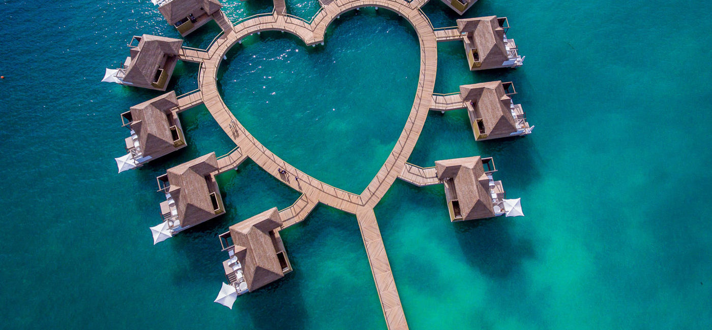 Image: PHOTO: Over-the-Water Bungalows at Sandals South Coast. (photo via Sandals Resorts) (Sandals)