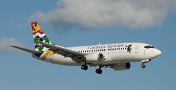Cayman Airways plane on approach to the runway