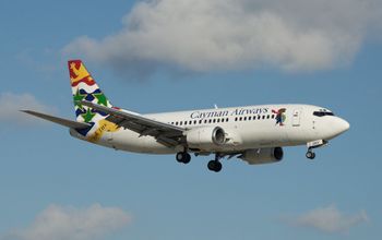 Cayman Airways plane on approach to the runway