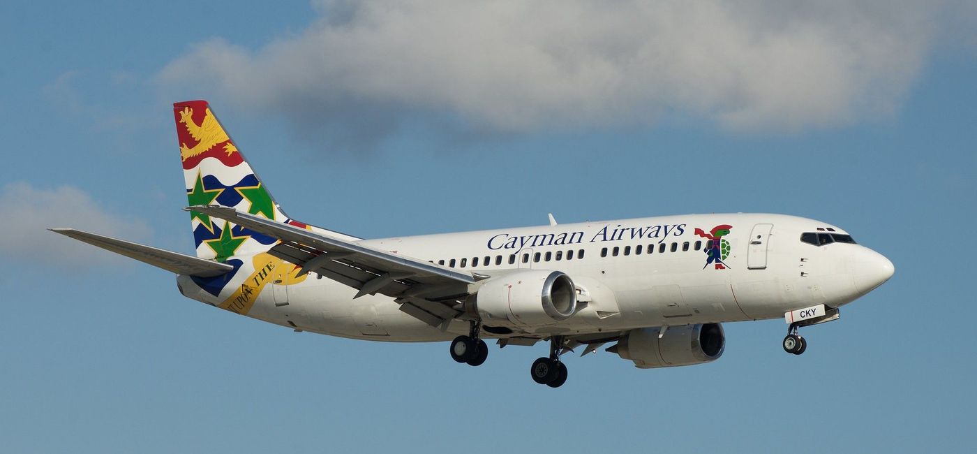 Image: PHOTO: Cayman Airways plane on approach to the runway. (photo via Flickr/BriYYZ)
