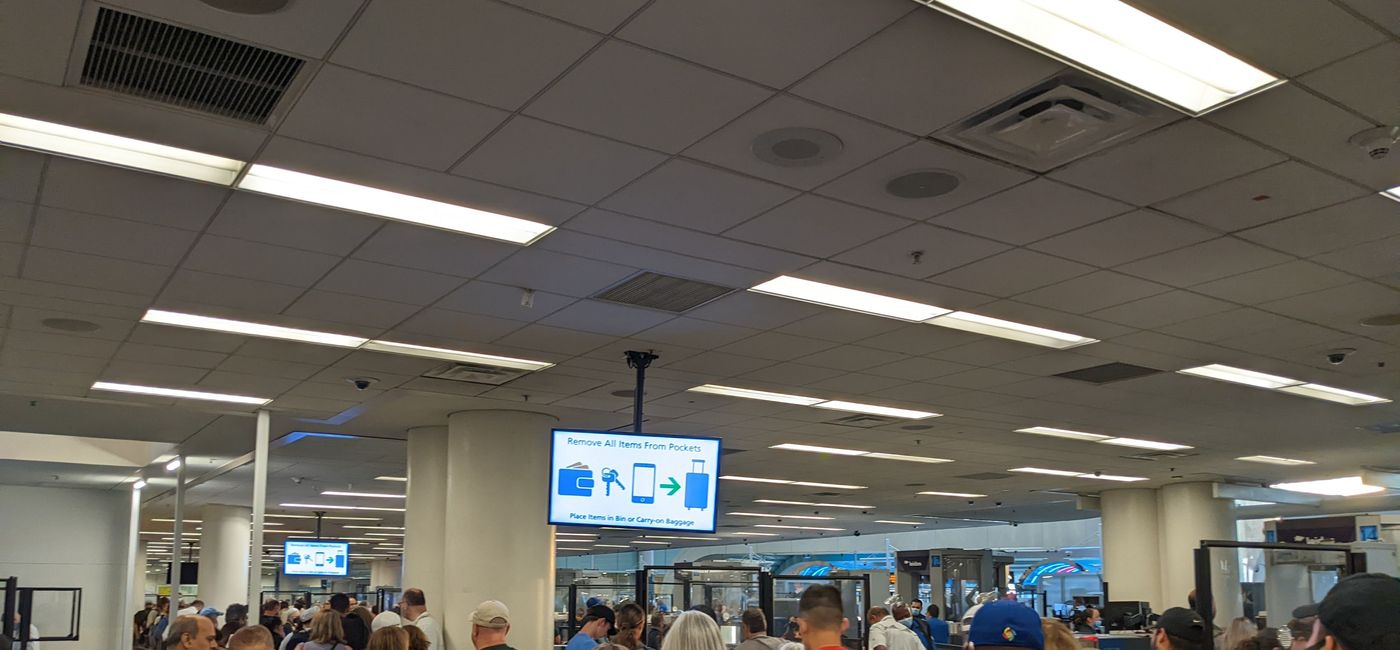 Image: Travelers wait to go through TSA security at the airport (photo by Eric Bowman)