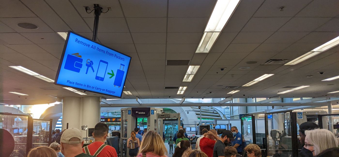Image: Travelers in line at TSA checkpoint at airport (photo by Eric Bowman)