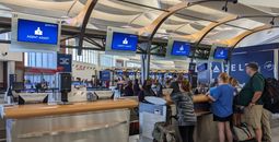 Travelers at airport, agent assistance, delta, air travel