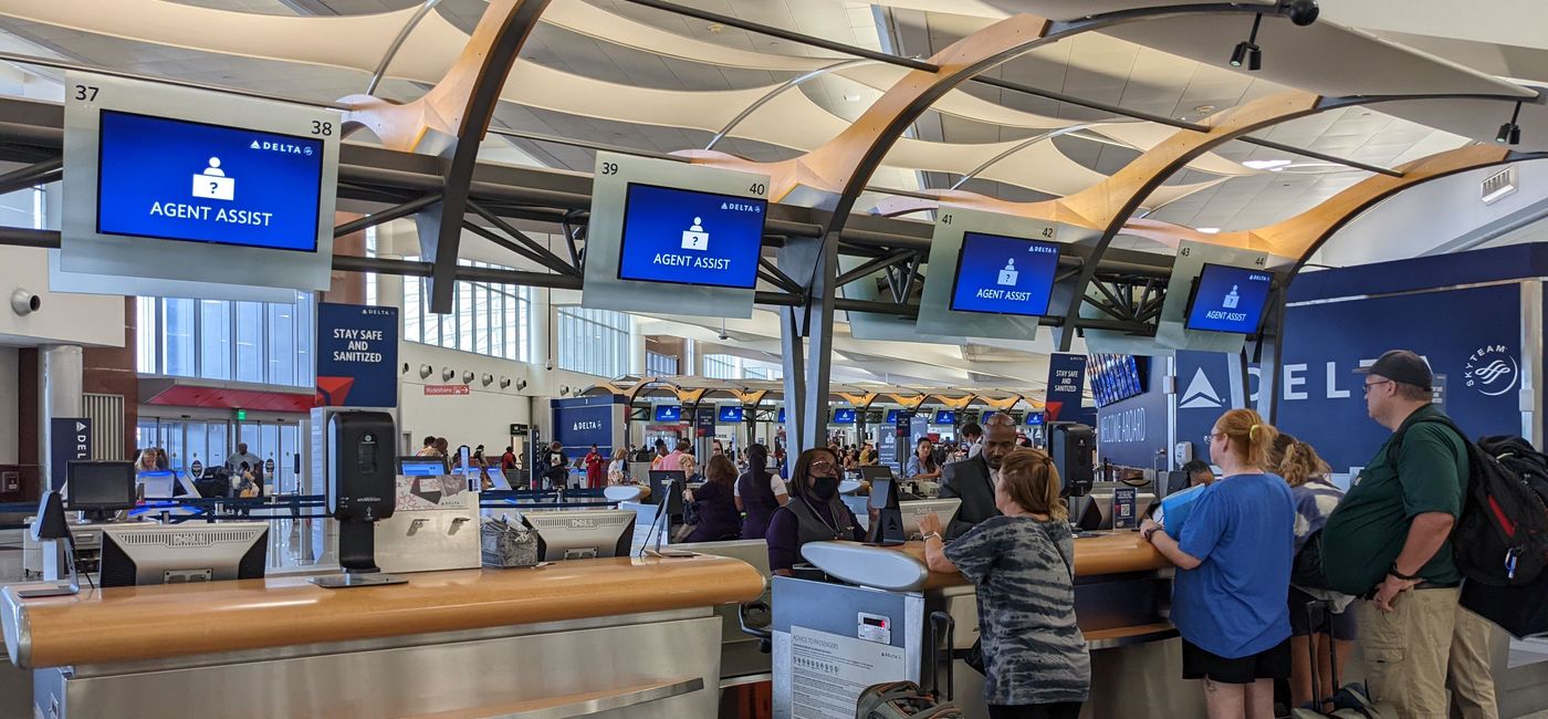 Image: Travelers get assistance at the airport (photo by Eric Bowman)