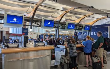 Travelers at airport, agent assistance, delta, air travel