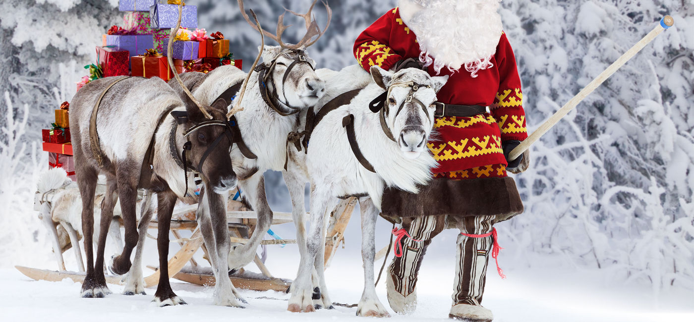 Image: A Santa Claus with his reindeer and sleigh. (Photo via iStock/Getty Images Plus/Artpilot)
