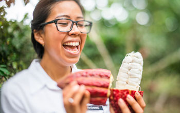 Woman holds a cacao pod at Hacienda La Danesa