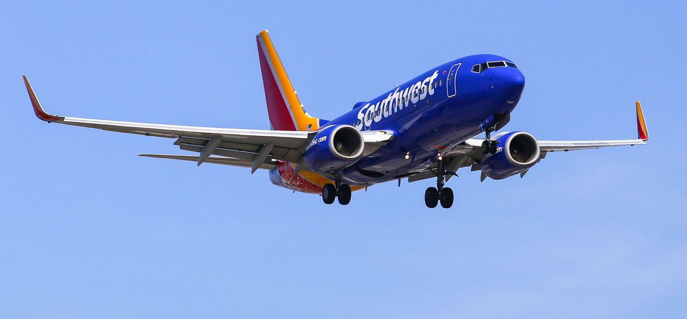 Image: Southwest Airlines plane landing at LAX. (photo via mixmotive/iStock Editorial/Getty Images Plus)