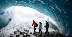 Guided tour in a glacial ice cave