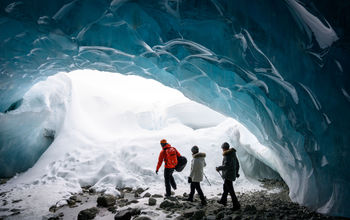 Guided tour in a glacial ice cave