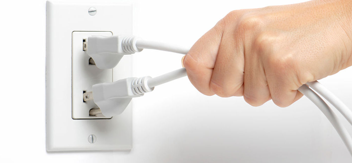 Image: PHOTO: Unplugging plugs from outlet. (photo courtesy of Thinkstock)