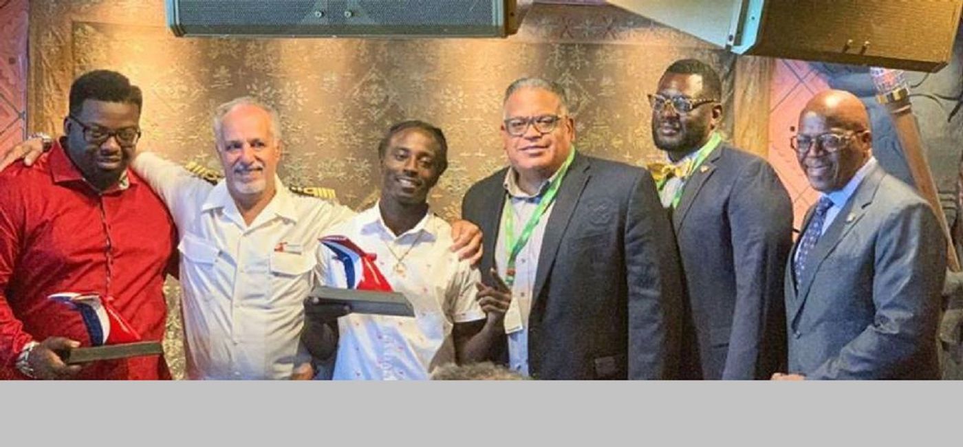 Image: Kashief Hamilton and Randolph Donovan, Jr. were honored Monday. Left to right: Kashief Hamilton; Captain Candeloro Donato; Randolph Donovan, Jr.; Joseph Boschulte, commissioner of tourism; Kevin Rodriguez, governor's office deputy chief of staff and Senator Myron Jackson. (US Virgin Islands Department of Tourism)
