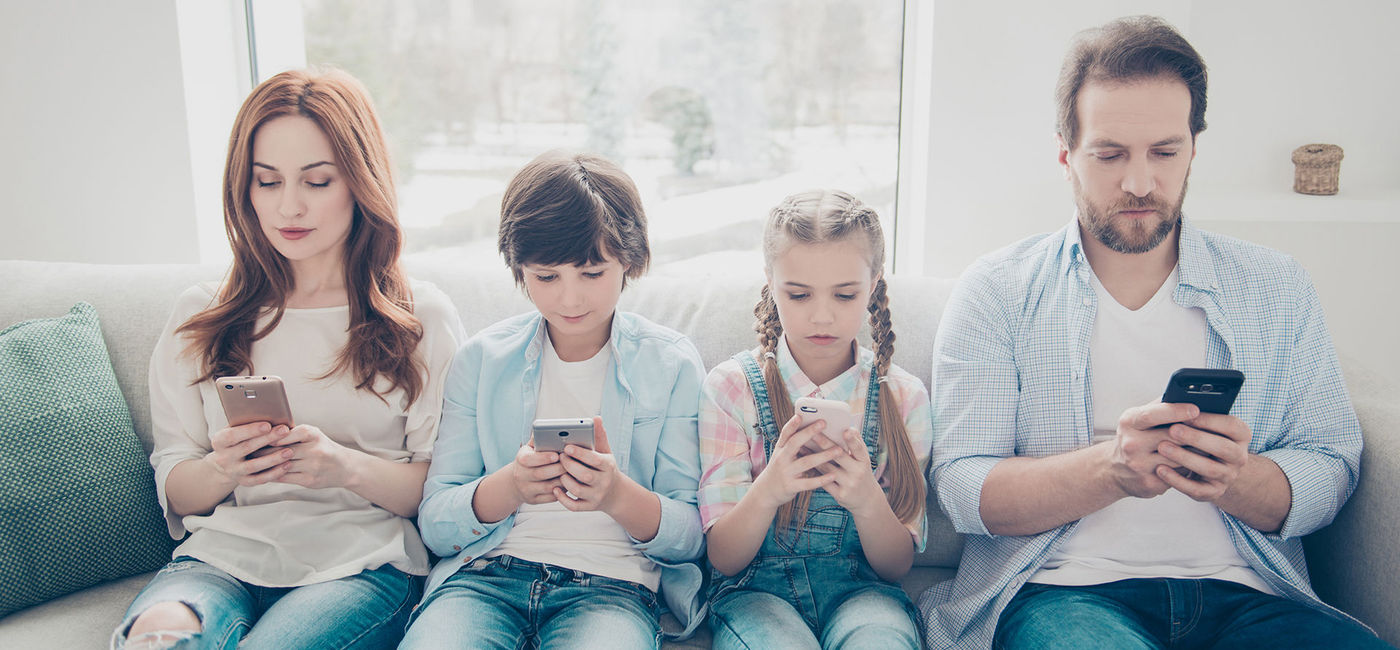Image: PHOTO: Family on devices (photo courtesy Deagreez/iStock/Getty Images Plus)