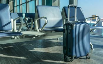 Carry-on luggage at an airport gate