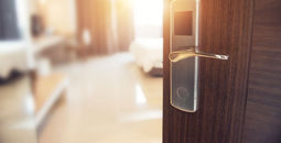 Opened door of hotel room in morning