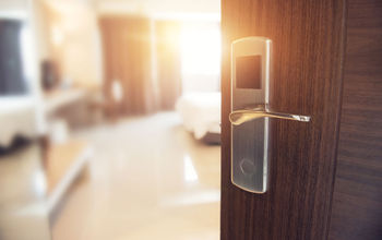 Opened door of hotel room in morning