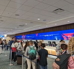 Baggage line at the airport, check bags, air travel, crowd,