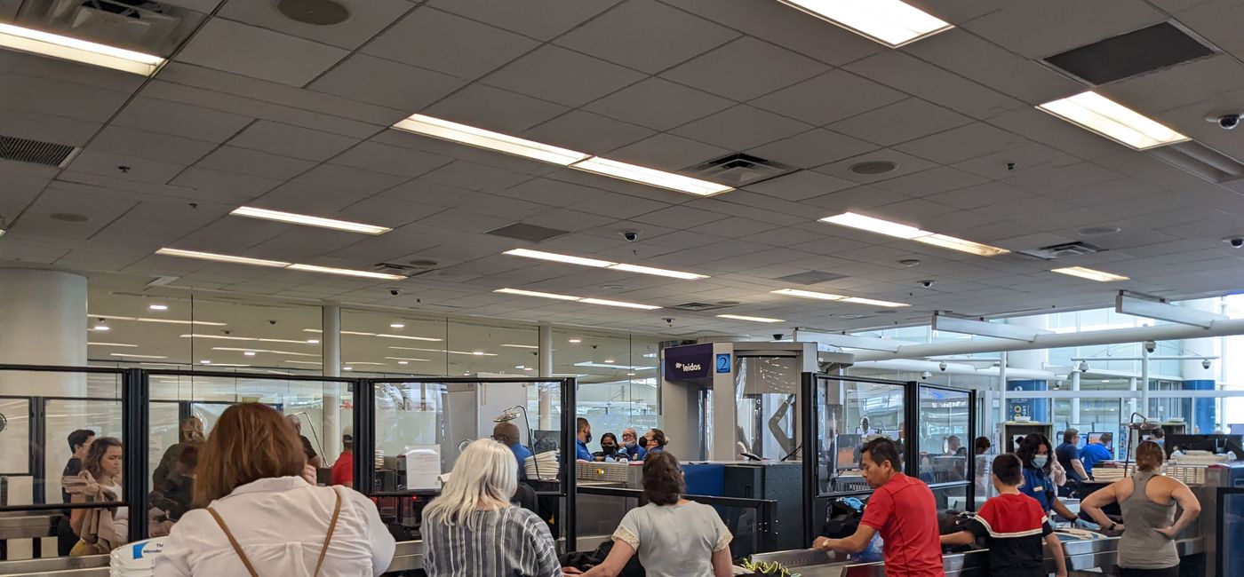 Image: Travelers wait in TSA security line at the airport (photo by Eric Bowman)