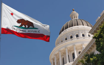 California's state flag waving outside the Capitol Building in Sacramento.