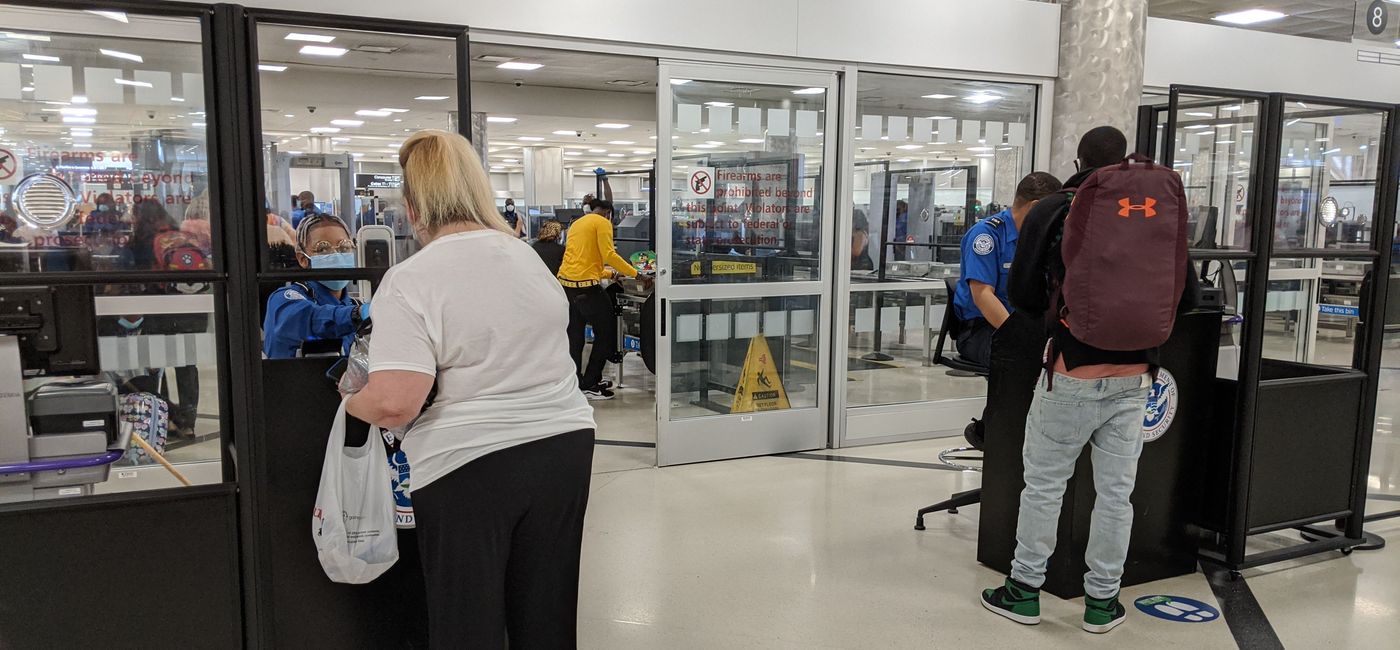 Image: PHOTO: Travelers check in with TSA at Atlanta Airport (photo by Eric Bowman)