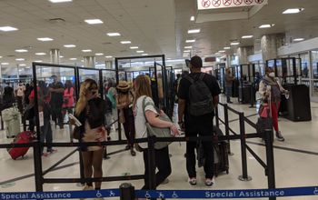 Travelers waiting in security line