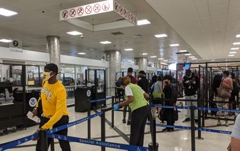 Travelers waiting in the security line at the airport