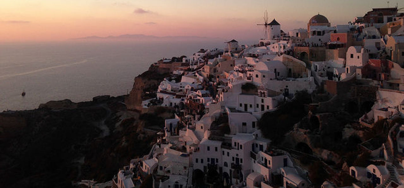 Image: PHOTO: The island of Santorini at twilight. (photo via Flickr/Maggie Meng)