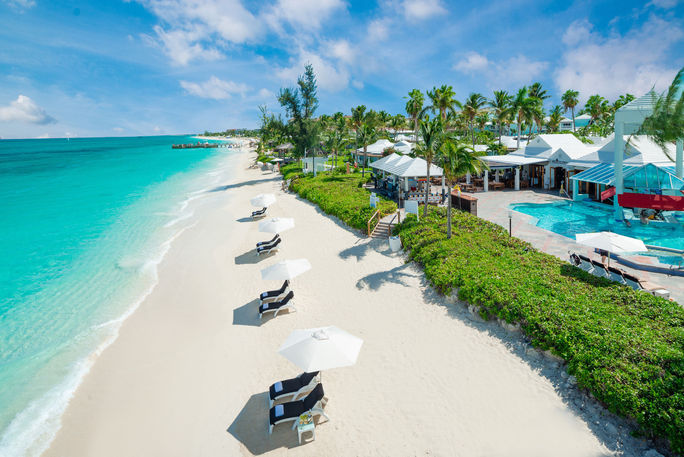 Sun loungers on the pristine sands of Beaches Turks & Caicos all-inclusive family resort. lounger, shore, sands, beach, Beaches, Turks and Caicos, all-inclusive, family-friendly, Caribbean