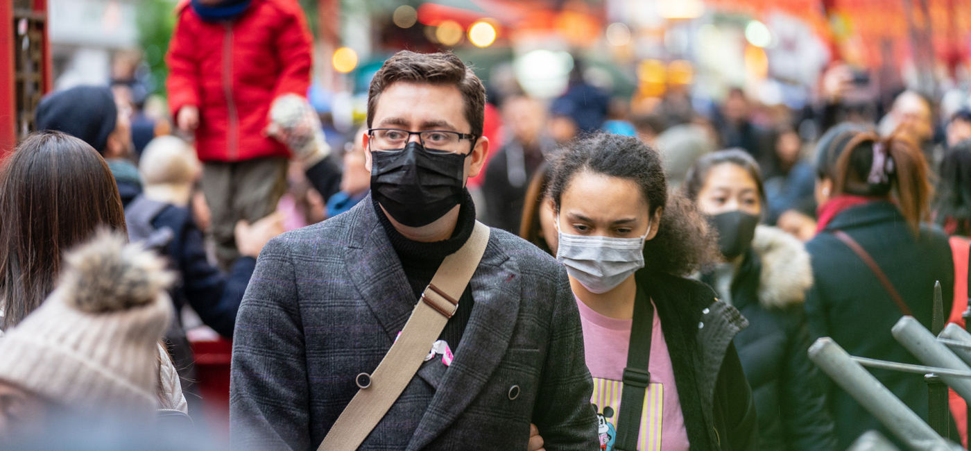 Image: PHOTO: Travelers wearing masks amid the coronavirus outbreak. (Photo via Powerofflowers/iStock Editorial/Getty Images Plus)
