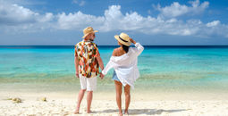 A couple enjoying Playa Porto Mari beach in Curacao