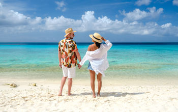 A couple enjoying Playa Porto Mari beach in Curacao