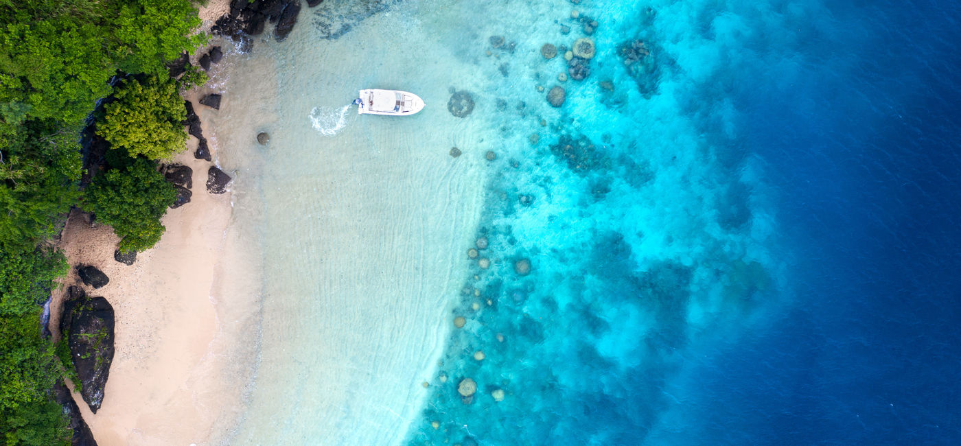 Image: Boat and beach (Photo via Tourism Fiji)