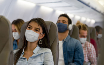People wearing masks on a flight