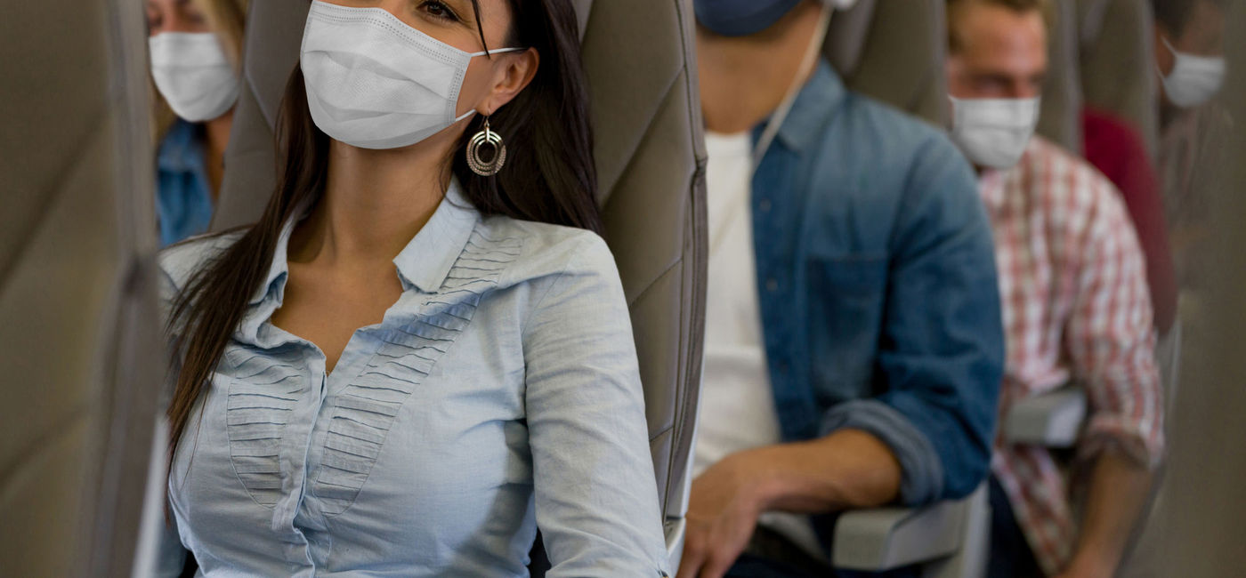Image: PHOTO: People wearing masks on a flight (photo via Hispanolistic / Getty Images ) (Hispanolistic / Getty Images)