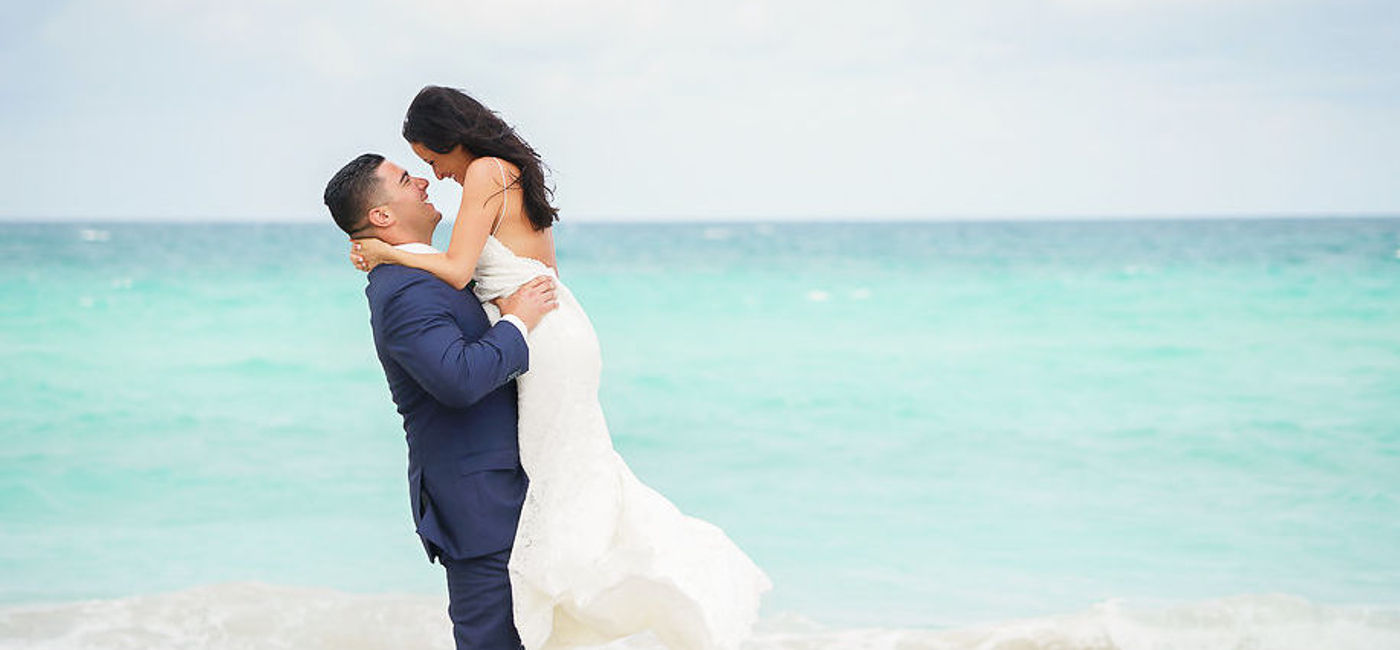 Image: A couple celebrating a wedding at Trump International Beach Resort. (photo courtesy of Trump International Beach Resort)