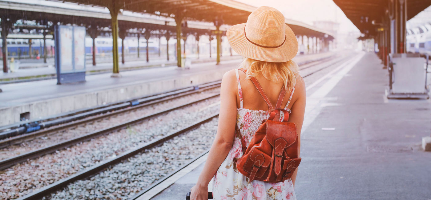 Image: Woman waiting for a train trip. (Photo Credit: anyaberkut/ Getty Images)