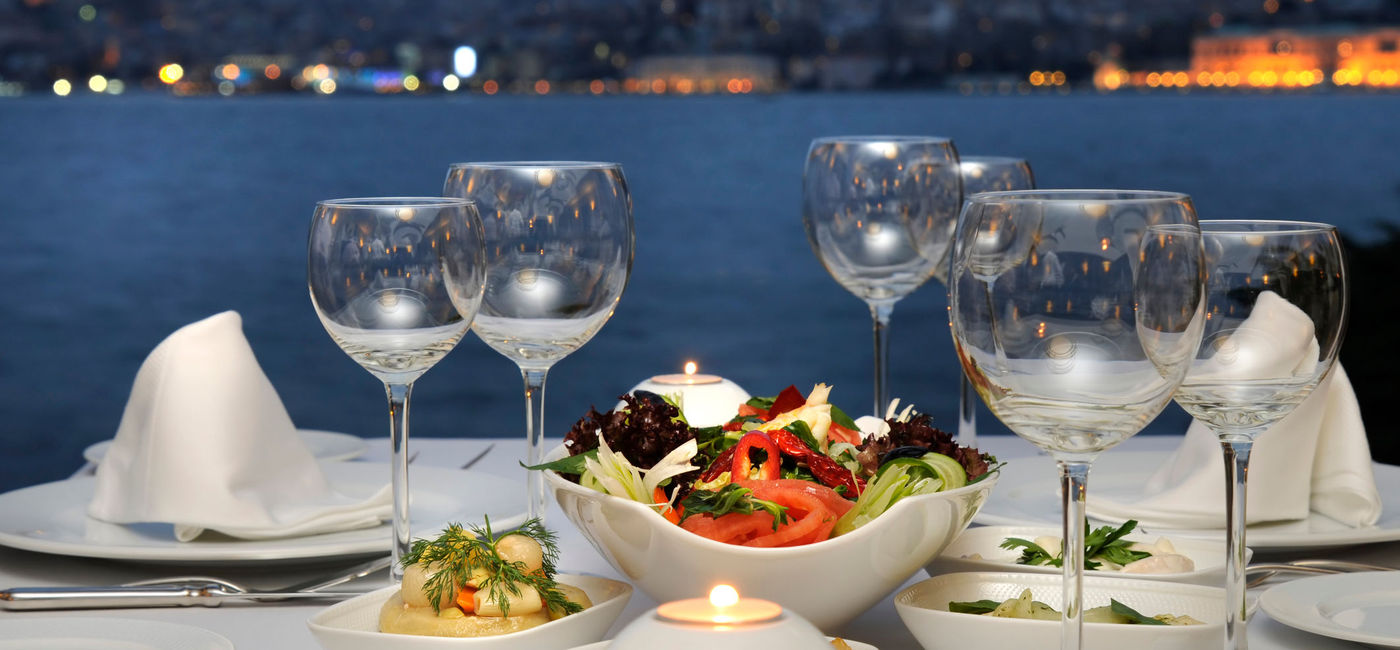 Image: PHOTO: Elegant dining with a stunning bayfront view.. (Photo via iStock / Getty Images Plus / Czgur)