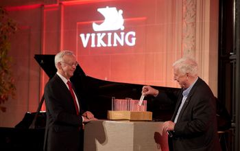 Viking Chairman Torstein Hagen pictured viewing a representation of Viking’s fleet with Meyer Werft’s Bernard Mayer during the Viking Longships Naming ceremony in Paris.