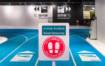 Social distancing sign at Airport in Tokyo, Japan.