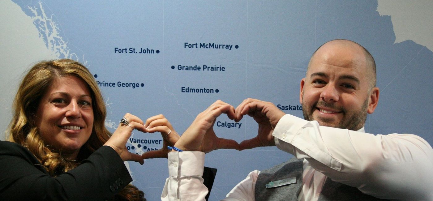 Image: PHOTO: WestJet BDMs Emily Spadafora (BC & Yukon) and Josh Knox (AB, SK & NT) showing some home-town love. (Photo by Brian Simpson/TravelPulse Canada) (Brian Simpson)