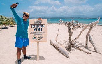 Man taking a photo at Cayo Cardona, part of the Population: YOU campaign