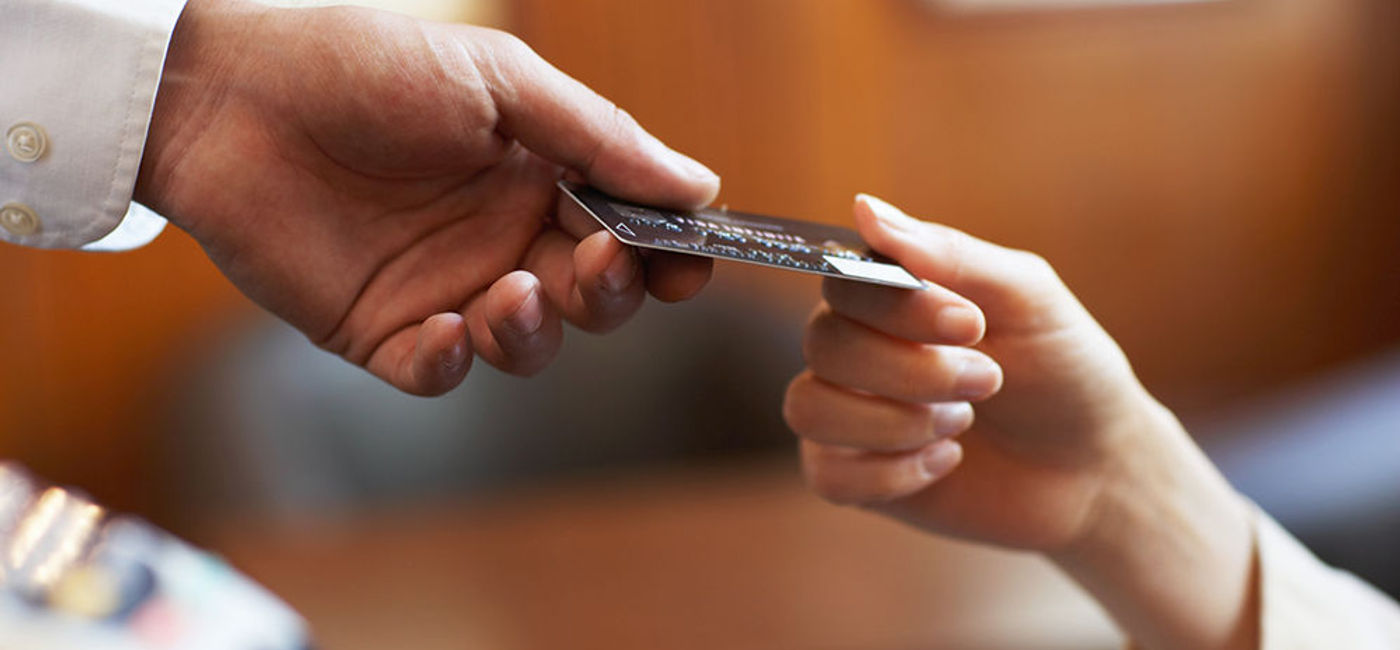 Image: PHOTO: Paying with a credit card. (photo courtesy of Thinkstock)