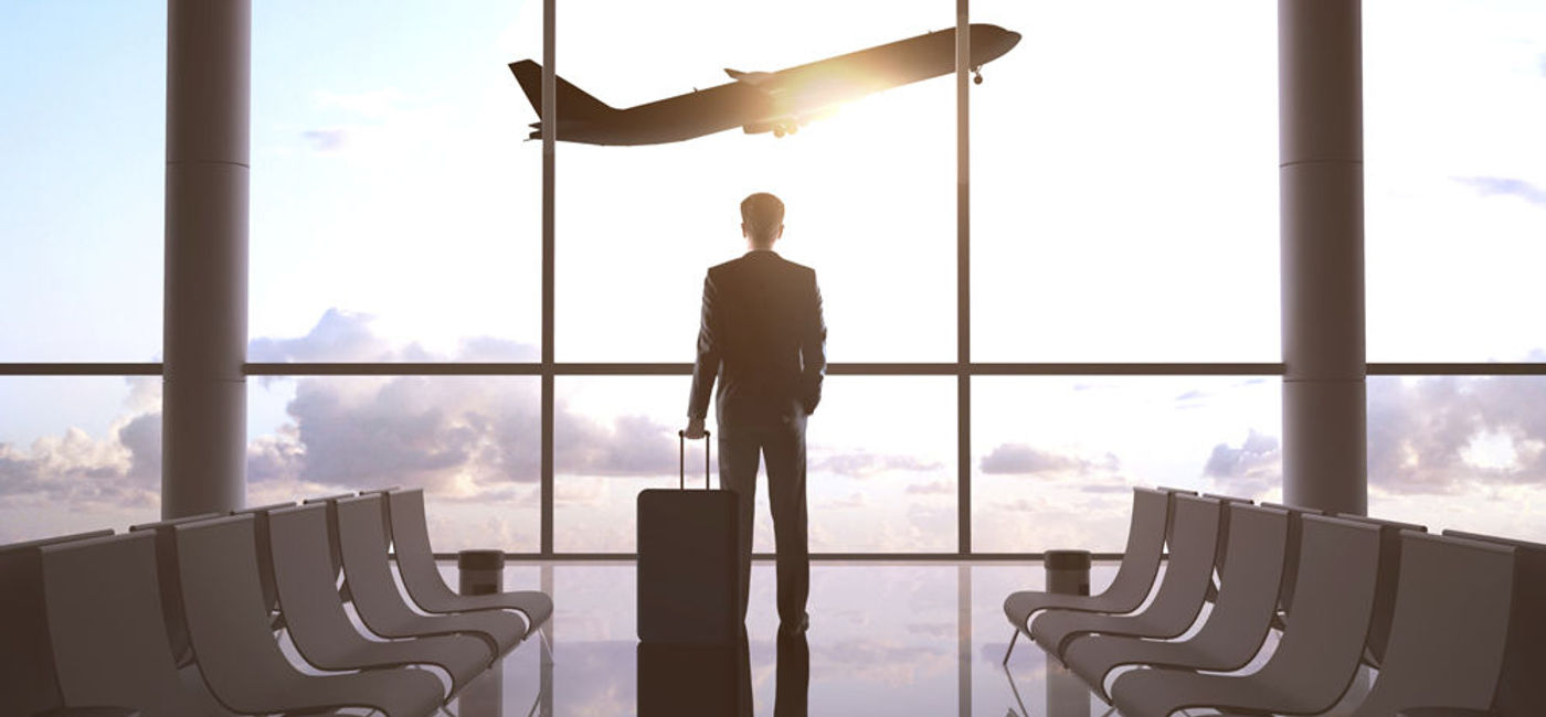 Image: PHOTO: Business traveler at an airport. (photo courtesy of Thinkstock)