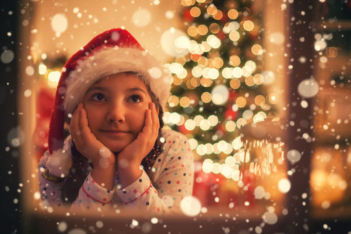 A little girl waiting for Santa on Christmas Eve. A little girl waiting for Santa on Christmas Eve.