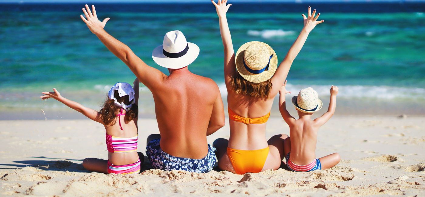 Image: A family enjoying a day at the beach. (photo via evgenyatamanenko/iStock/Getty Images Plus)