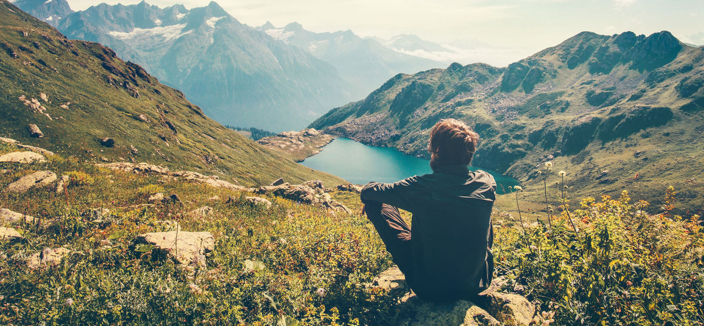 Image: A Thinking Traveler Enjoys a Nice View of the Mountains (Getty Images)