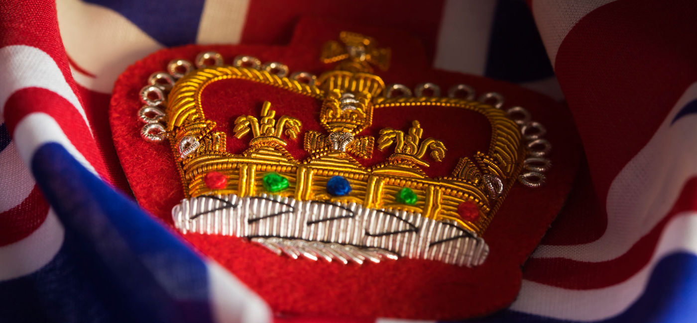 Image: Embroidered Queens Crown Badge and Union Jack. (photo via stocknshares / iStock / Getty Images Plus)