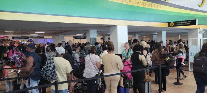 Travelers at Sangster International Airport in Montego Bay, Jamaica. Travelers at Sangster International Airport in Montego Bay, Jamaica.