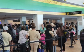 Travelers at Sangster International Airport in Montego Bay, Jamaica.