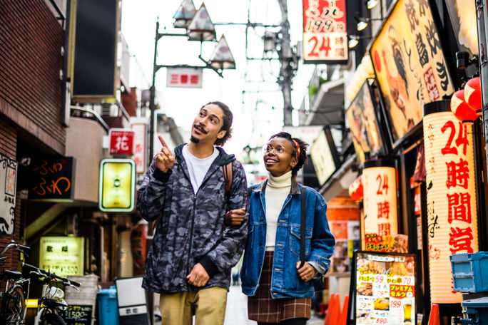 Couple vacationing in Tokyo, Japan Couple vacationing in Tokyo, Japan